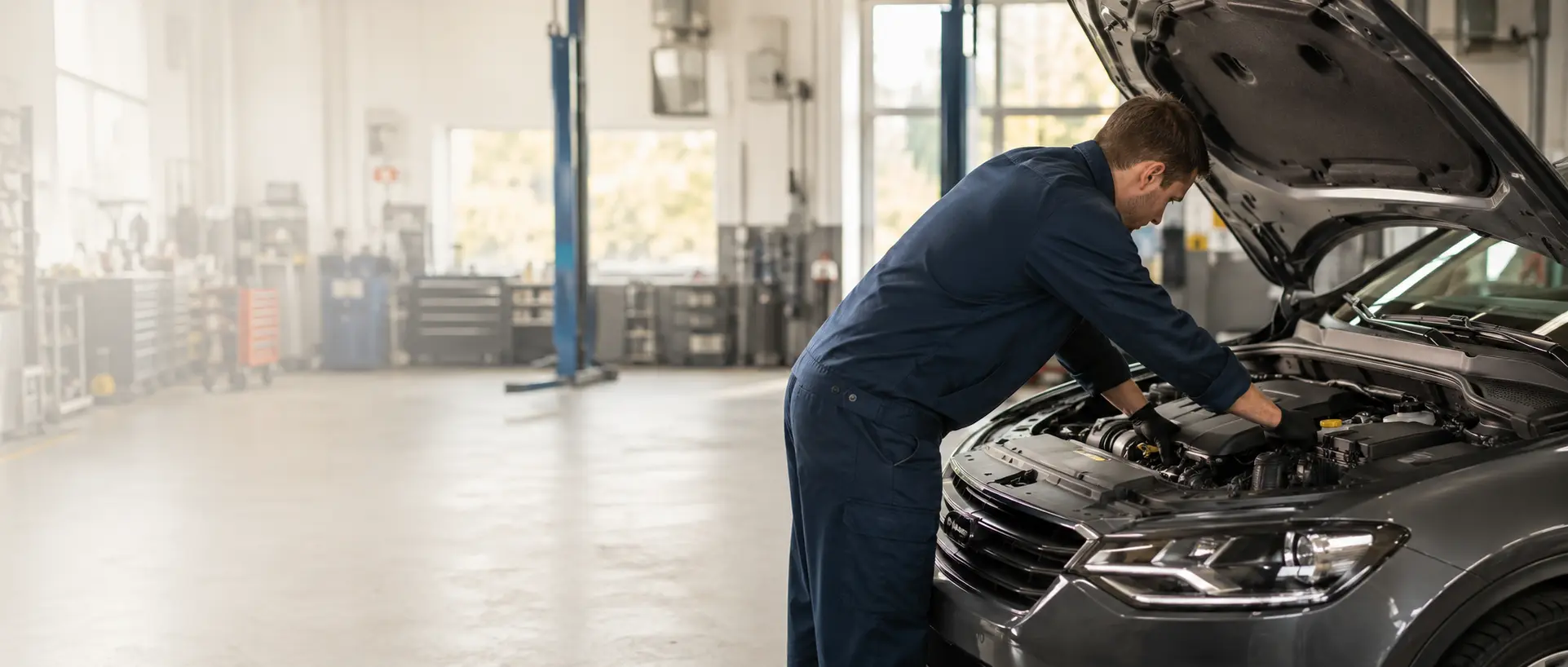 Professional mechanic working on a car engine